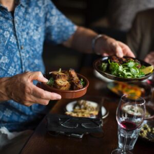 Tapas being passed around a table