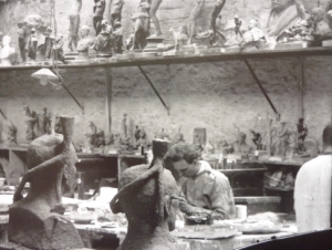 A detail from inside the model room at Singers, showing the skilled craftsmen working on models and finishing off pieces. Many of the Singers workforce had been educated at the Frome Art School, opened by John Webb Singer in 1865, before serving their apprenticeship at the works. Note all the wonderful plaster cast models, sadly now destroyed or missing. Printed from the original glass plate negative.