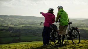 Couple enjoying a view while cycling