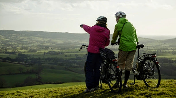 Couple enjoying a view while cycling