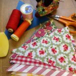 Sewing equipment for bunting laid out on a table