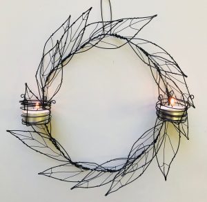 wire artwork with candles