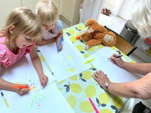 Image of a family drawing faces for flower fairies