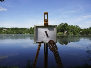 Easel in front of lake at Marston Park
