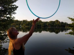 lady balance hula hoop on finger