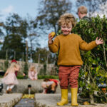 Boy holding an apple