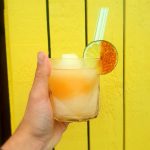 Hand holding a cocktail