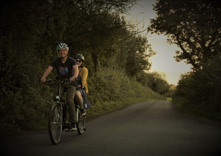 Couple riding a tandem ebike