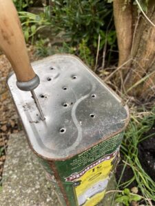 Holes being made in recycled planter