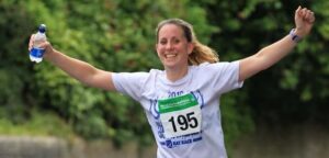 Lady finishing Frome Half Marathon