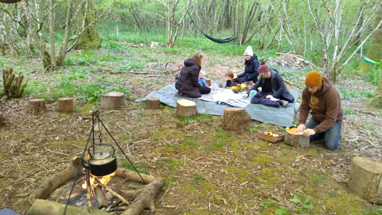 Earthwise - people sitting on a rug