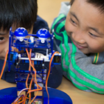 Children playing with a robot