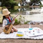 child playing a guitair