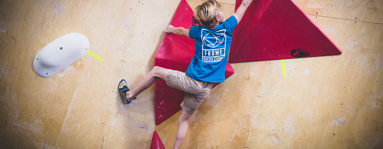 child on climbing wall