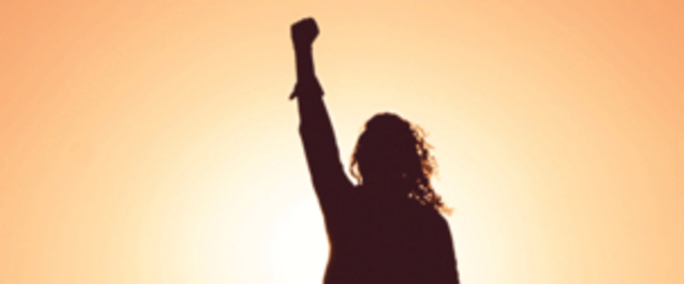 silhouette of person punching the air