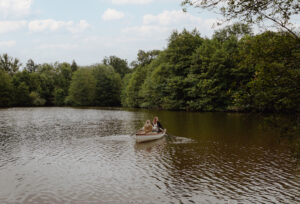 people rowing on lake